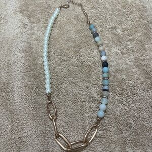 Gold and stone necklace.